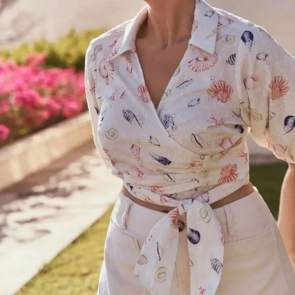 Anthropologie Maeve Puff Sleeve Wrap Crop Blouse with Eyelet and Seashells